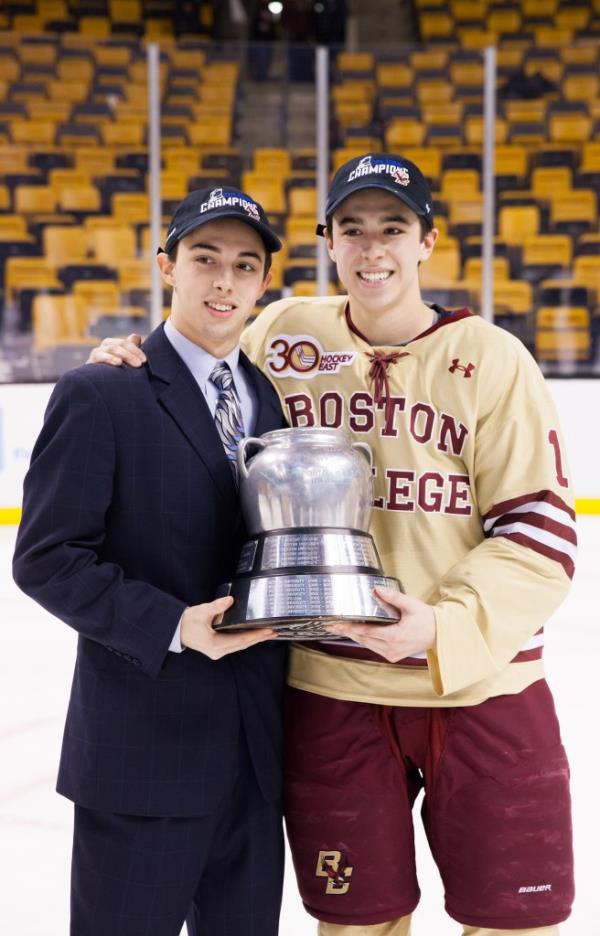 Brothers Johnny and Matthew Gaudreau celebrating with trophy after winning the 2014 Beanpot Championship for Boston College Eagles